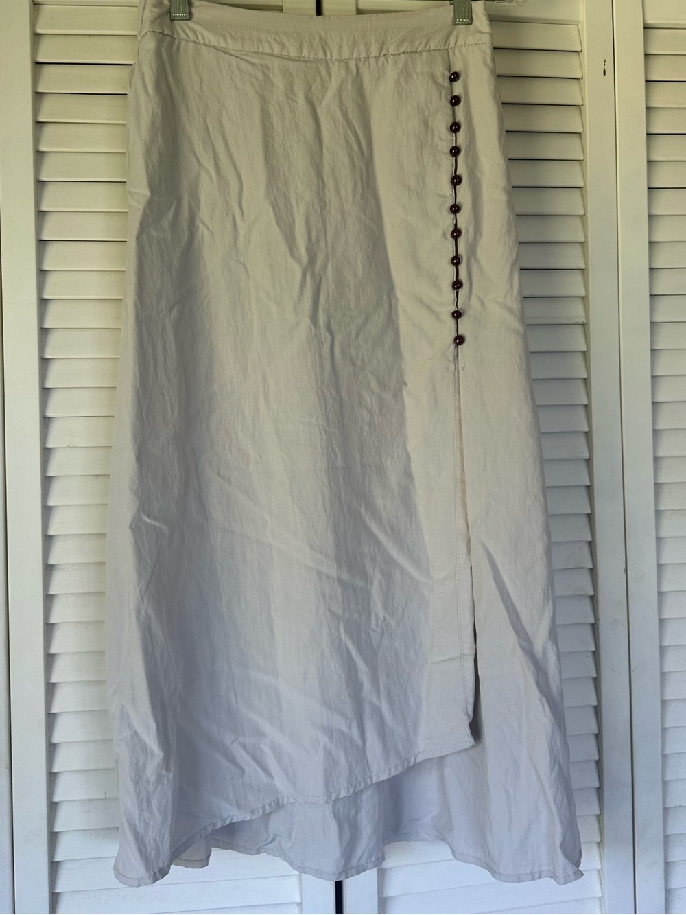 Cream Asymmetric High-Low Skirt with Side Button Detail